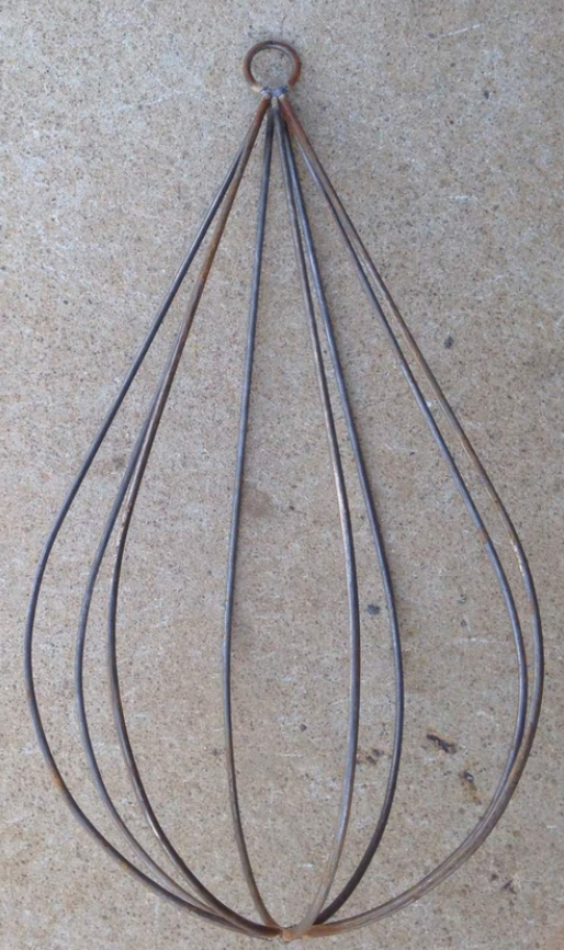 A solid steel decorative trellis with a rain drop shape design.